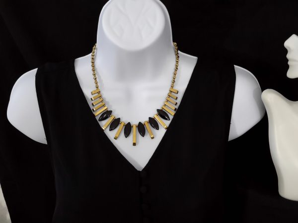 Gold barred hematite with black glass beads